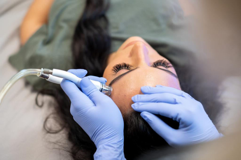 A close look at a patient receiving a deep cleaning facial 