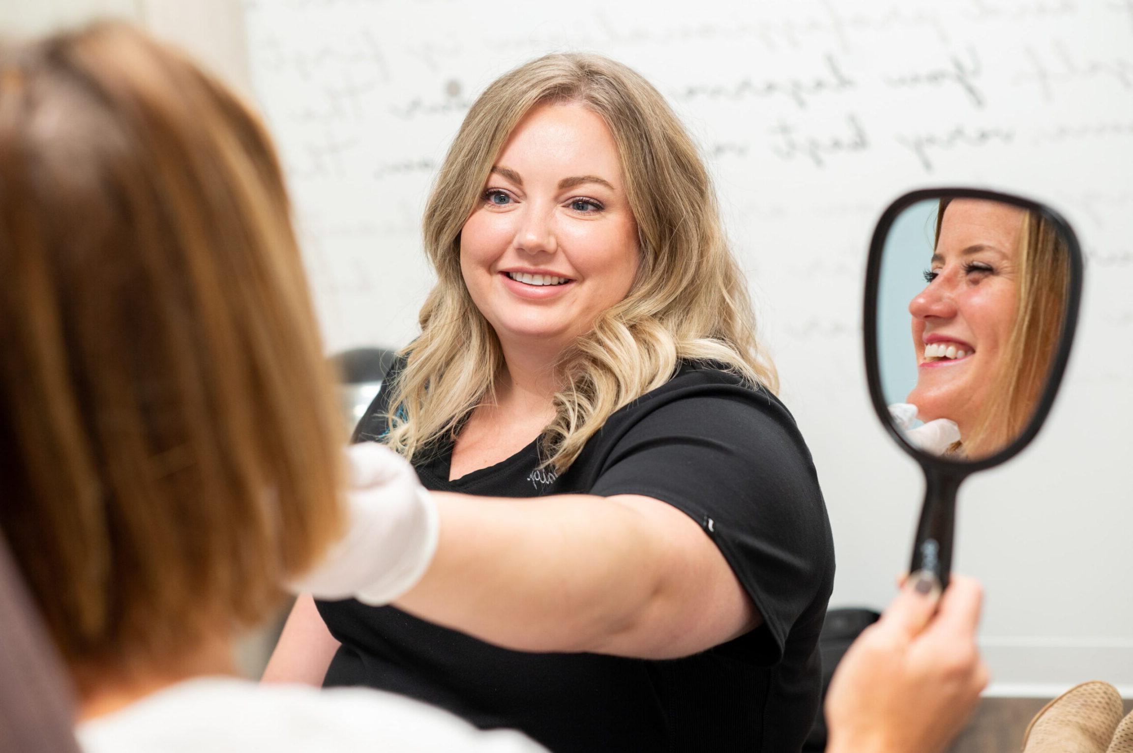 Paige performing a Rosacea skin consultation with a patient